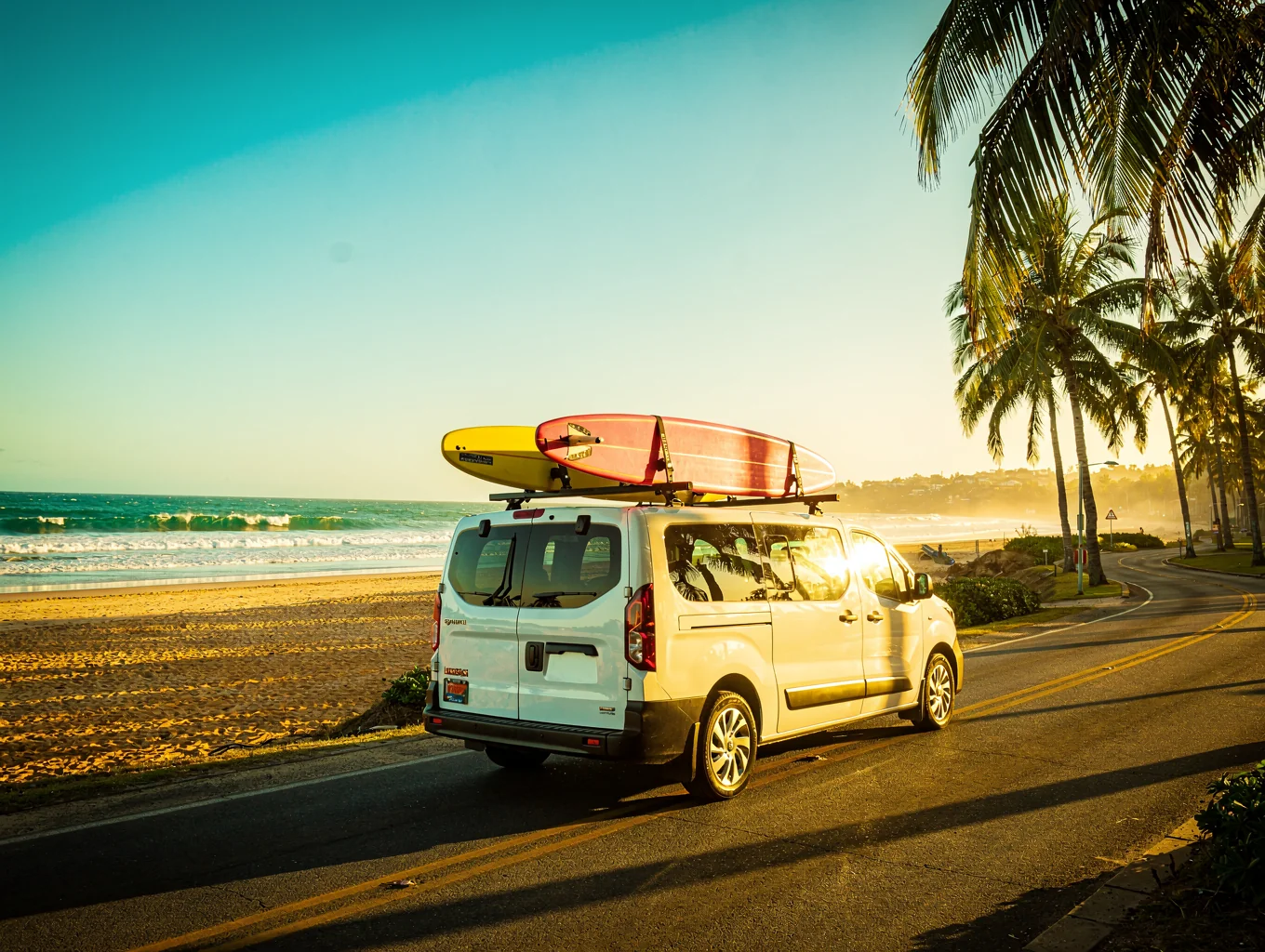 Surfboards strapped to a rugged roof rack